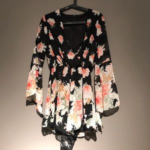 Beautiful black V-cut romper with floral pattern