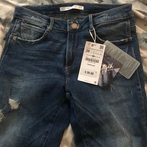 Comfy blue skinny jeans with fringe hemline!