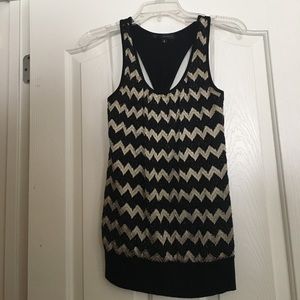 Black tank top with a gold chevron pattern.