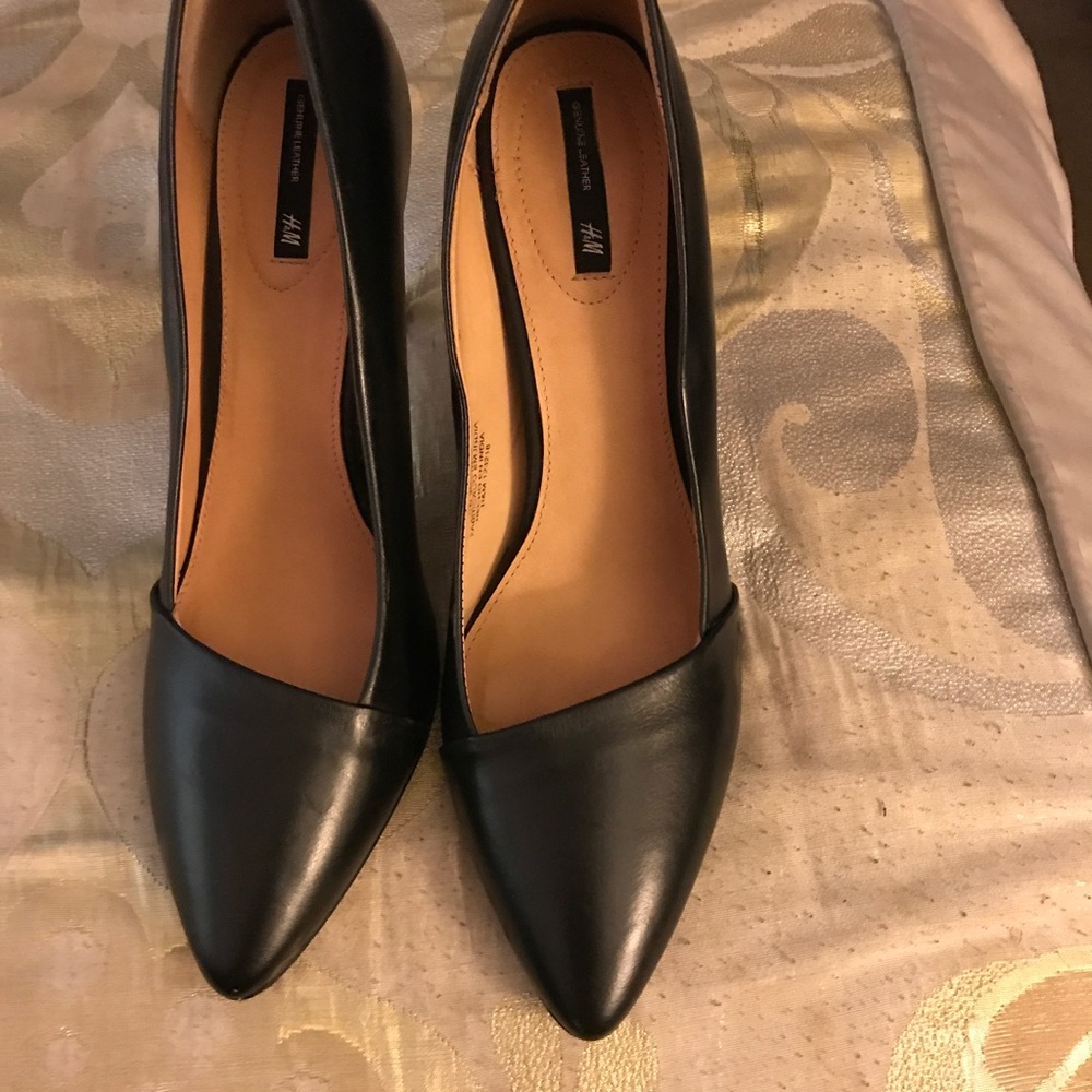 Black leather pumps