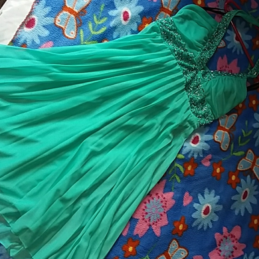 Turquoise dress with beaded trim on chest