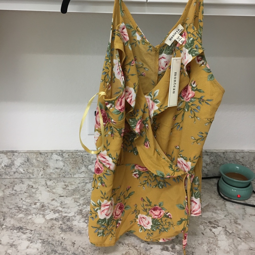 New floral top tags still on