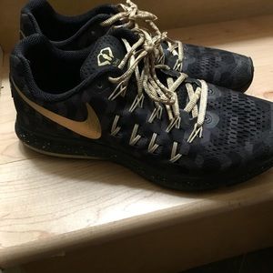 Black and gold Nike