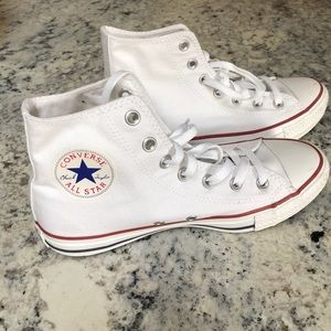 Converse white high tops.