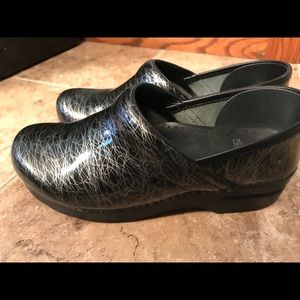 Dansko black patent leather with silver squiggles.