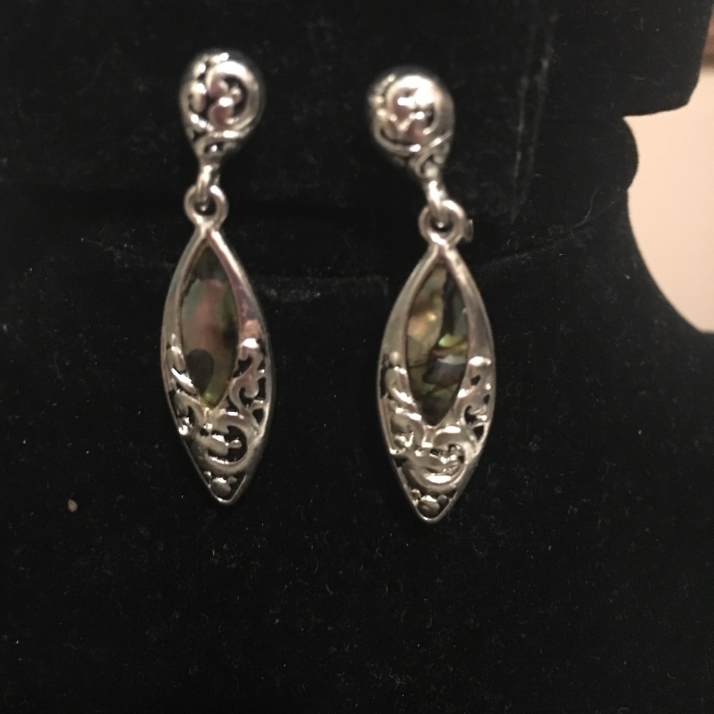 Stunning drop silver tone clip earrings.