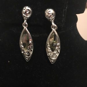 Stunning drop silver tone clip earrings.