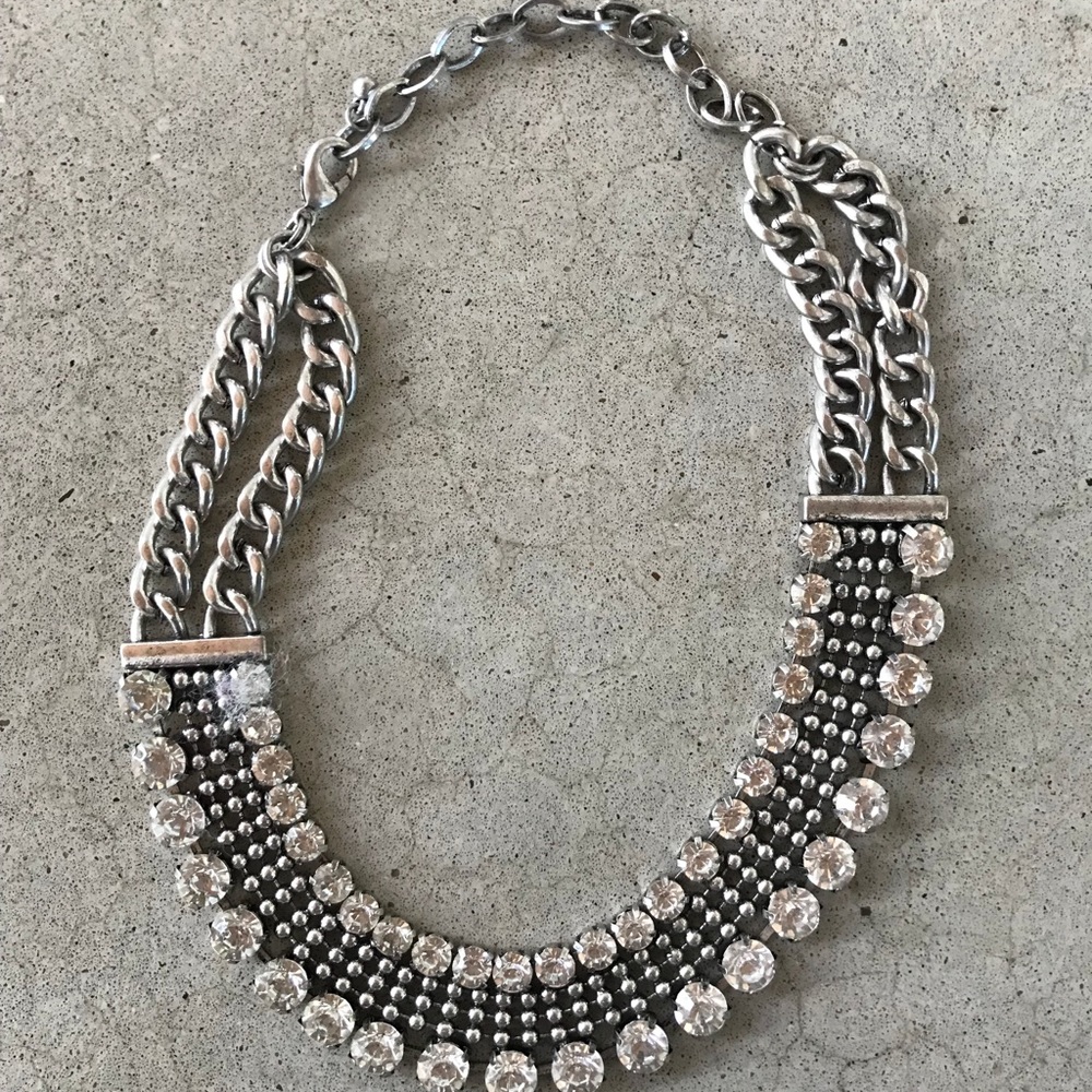 Costume necklace/choker with silver finish.