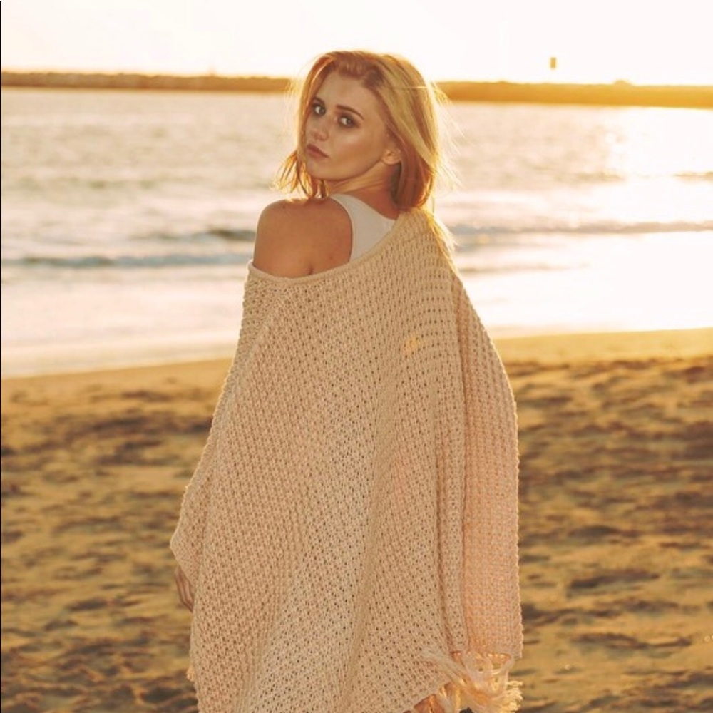 Chunky waffle fringe knit poncho.