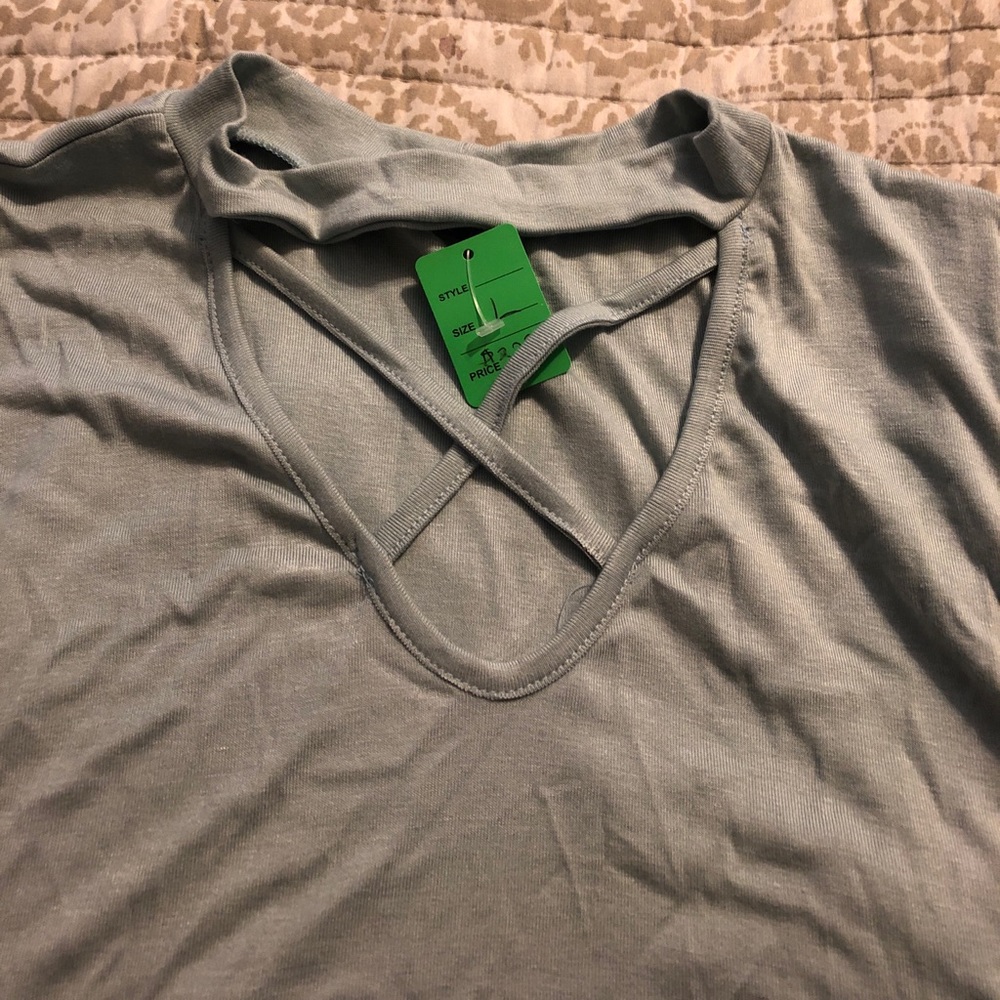 Light blue top.  Sleeveless.  Size large