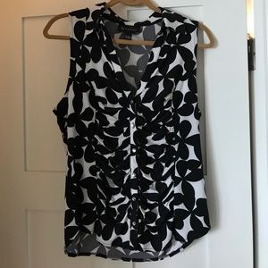 Sleeveless black and white blouse
