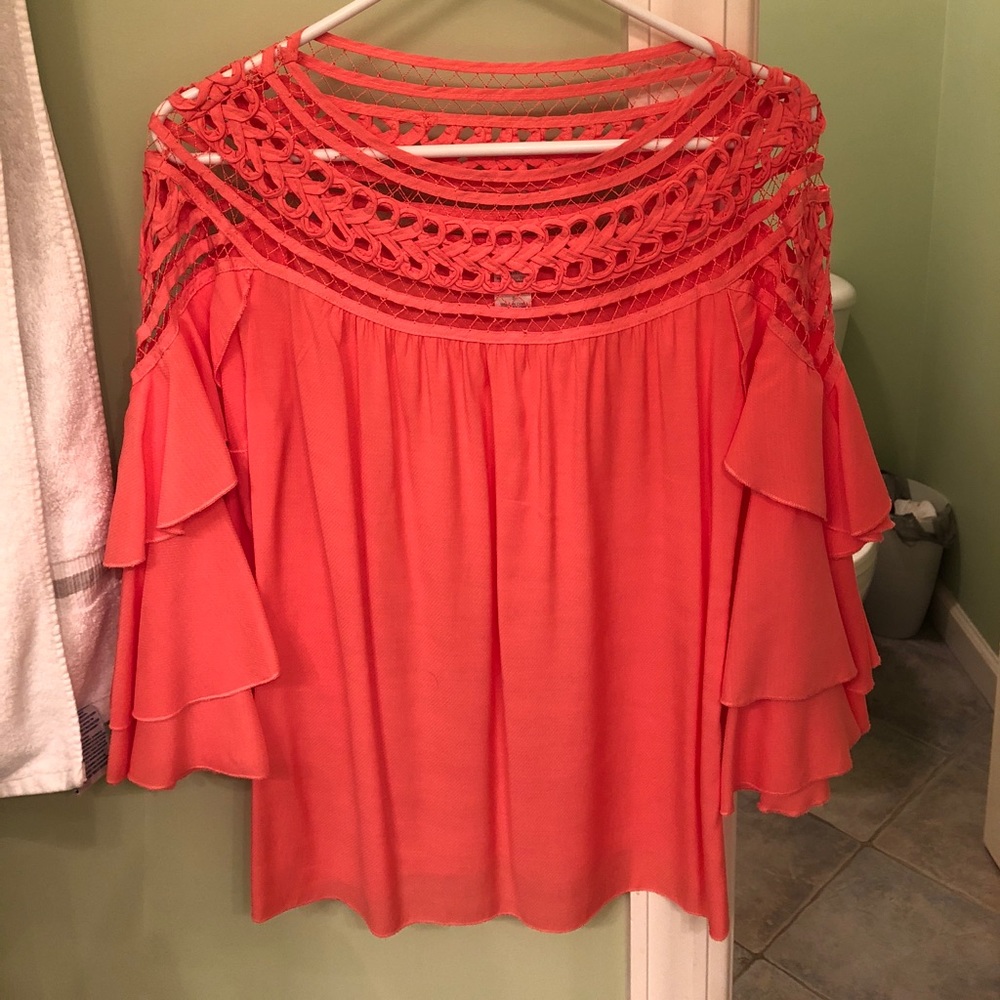 Orange juniors/ women’s top. Never been worn.