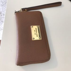 Used Michael Kors tan and gold wallet