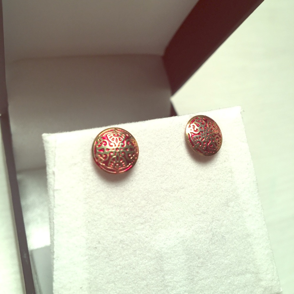 Intricate gold and red earrings
