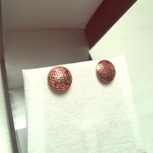 Intricate gold and red earrings