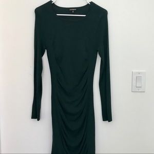Deep green body hugging sweater dress