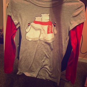 A coca- cola shirt