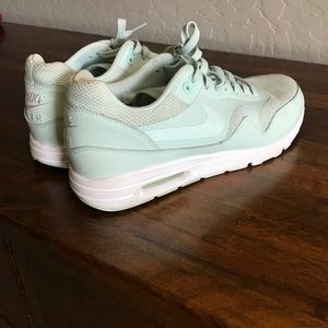 Turquoise Nike tennis shoes