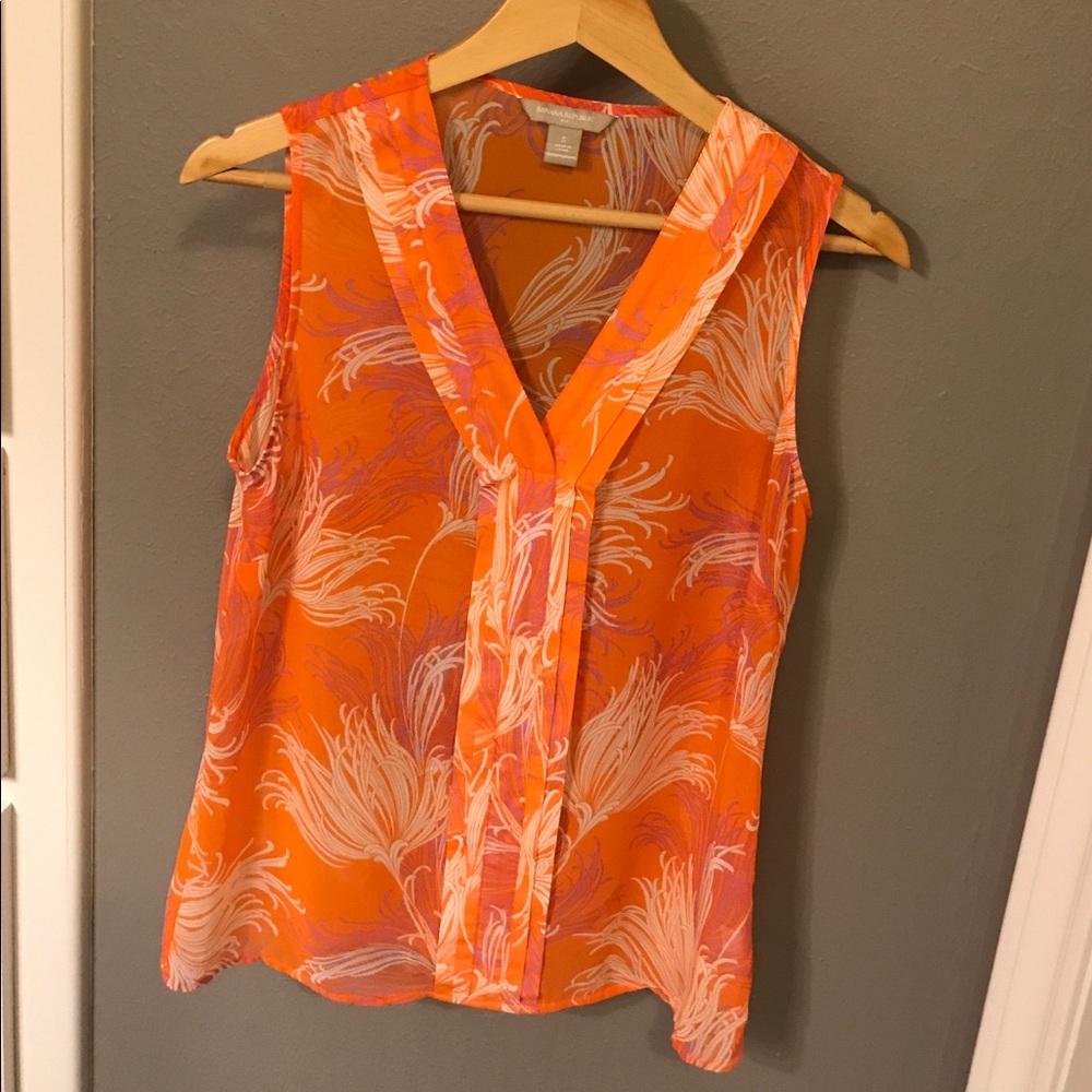 Orange patterned sleeveless blouse