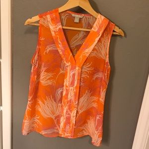 Orange patterned sleeveless blouse