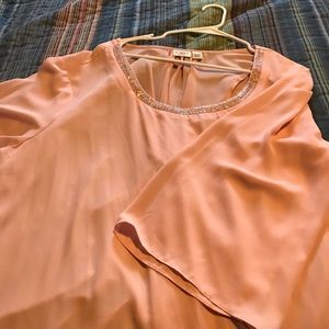 Peach embellished top.