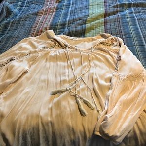 Cute top with embellished shoulders.