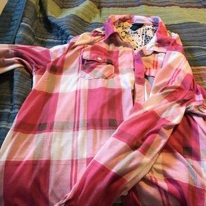 Pink plaid button up shirt.