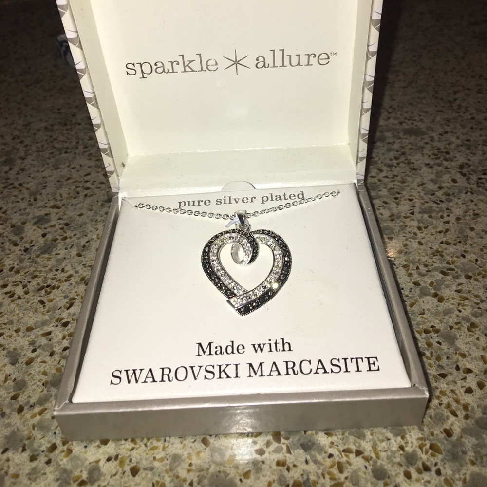 Pure silver plated heart necklace.