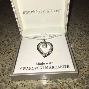 Pure silver plated heart necklace.