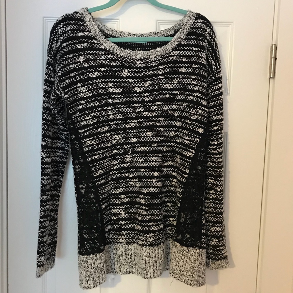 Maurice’s black and white sweater.