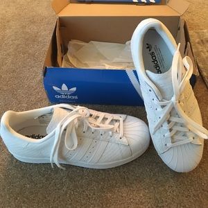 All white snake skin Adidas superstars size 9