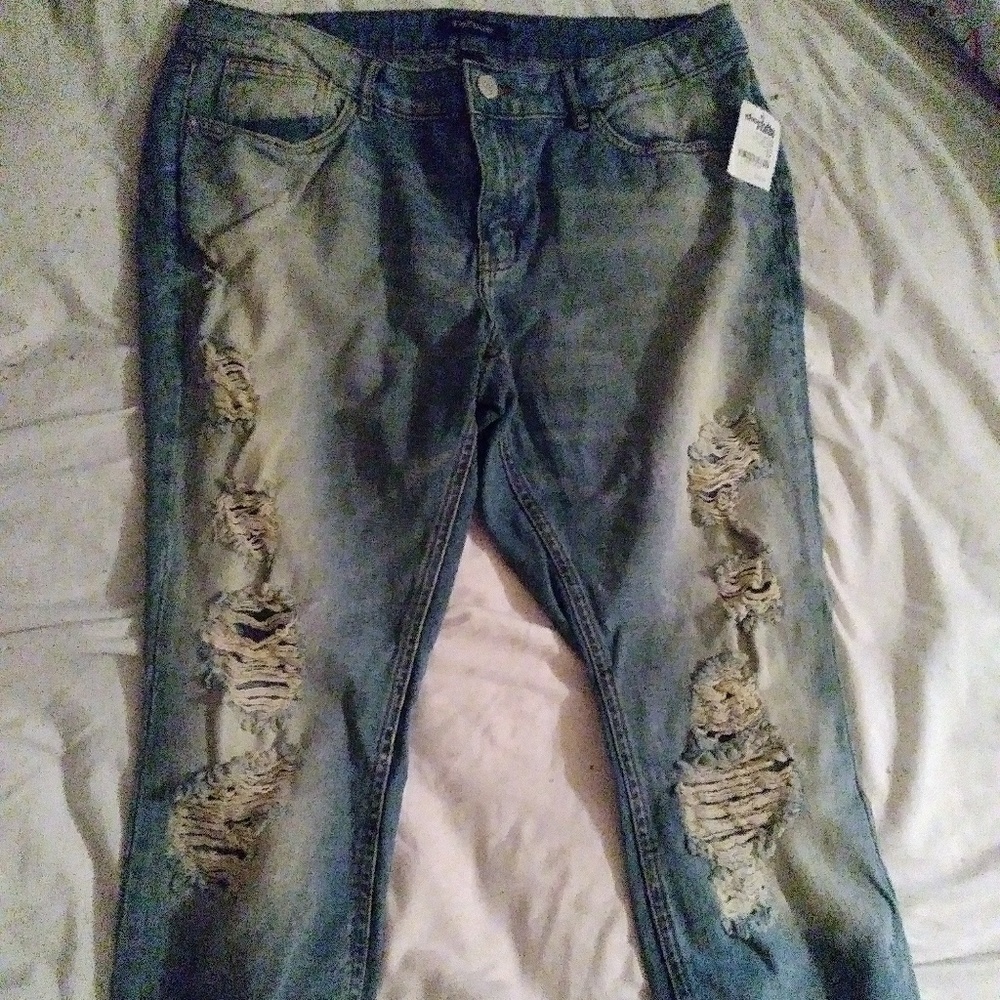 Brand new/ faded, distressed jeans