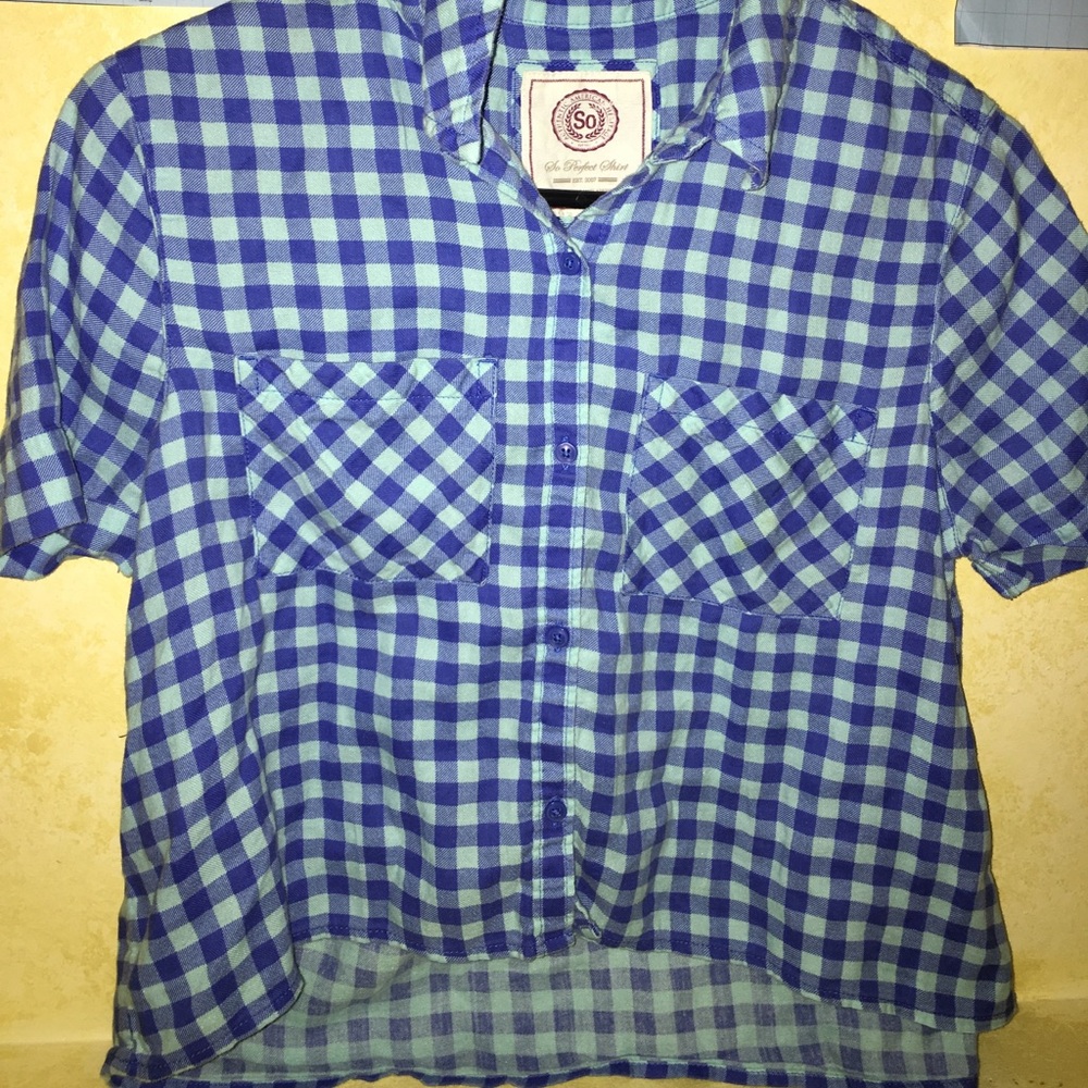 Plaid, blue cropped button down shirt.