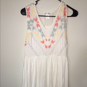 White detailed dress. Doesn’t show the full length