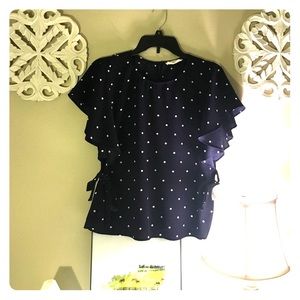 Navy and white polka dot shirt.