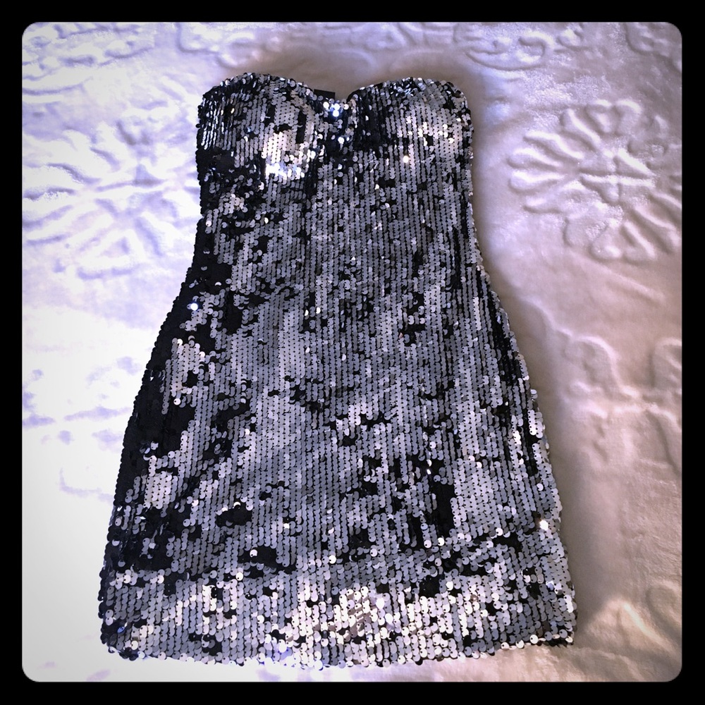 Silver, strapless, sequenced dress.