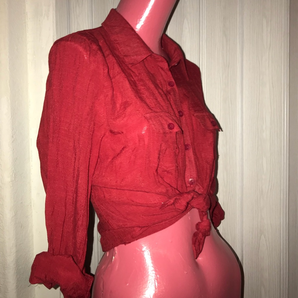 Red blouse tied at the waist