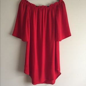 Red blouse dress off the shoulders.