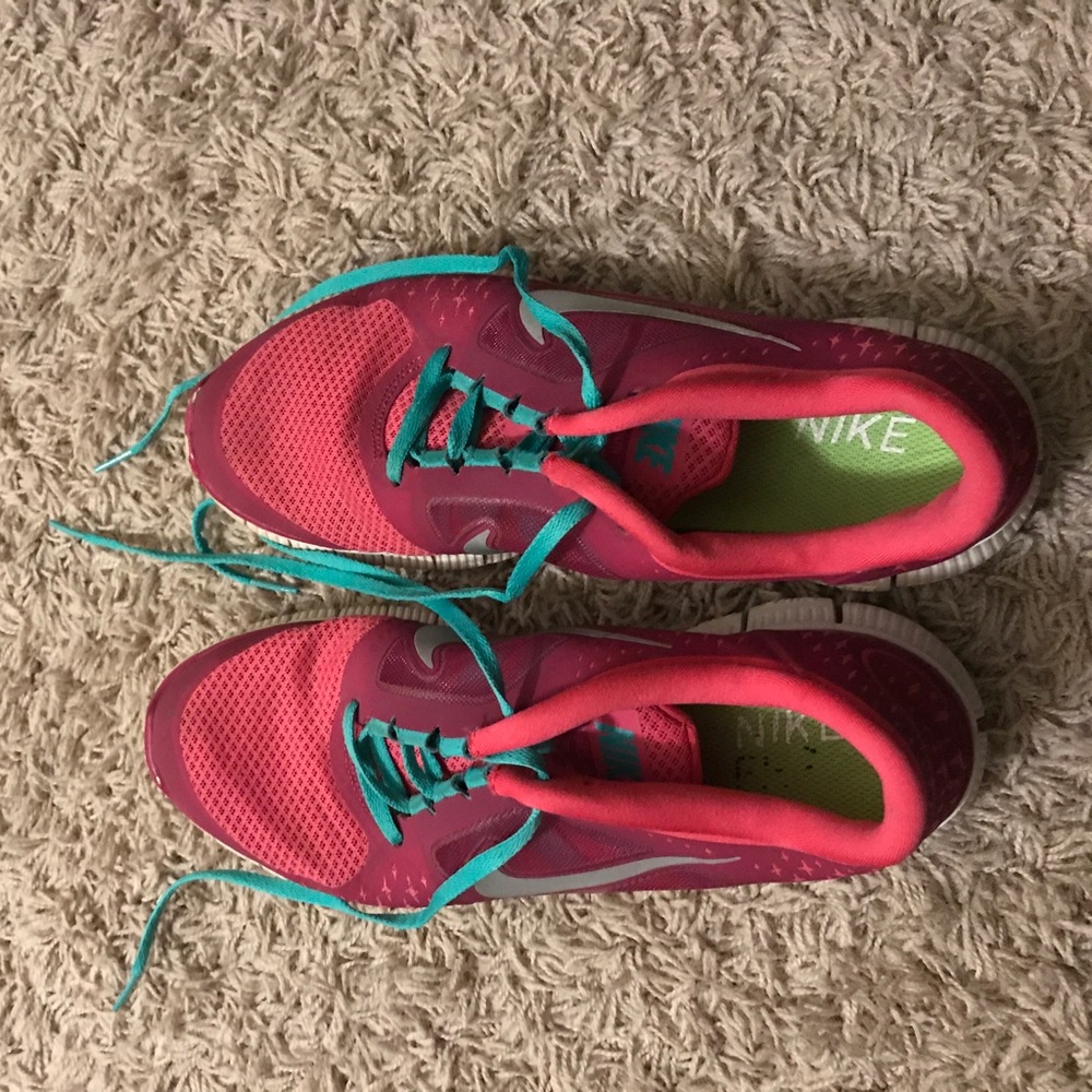Pink and teal Nike shoes
