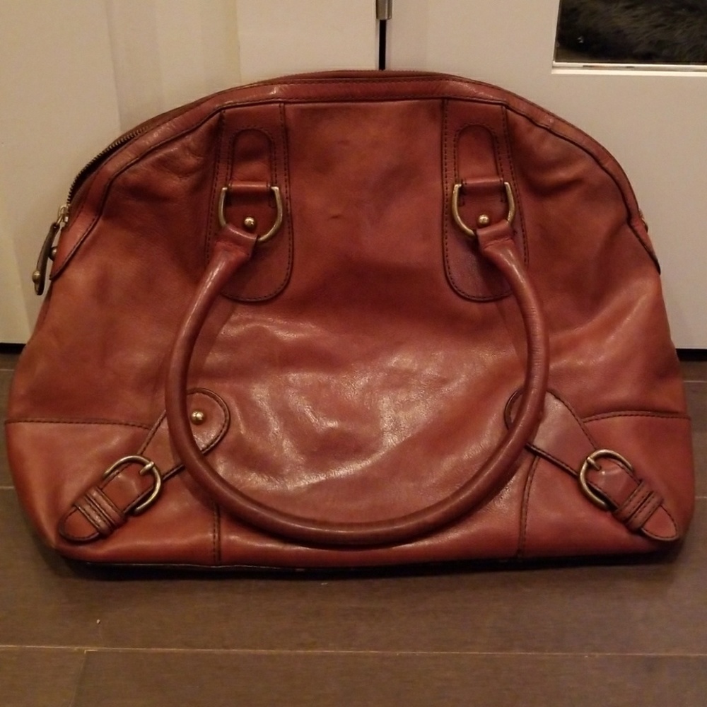 Brown worn in leather bag