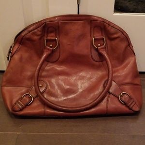 Brown worn in leather bag