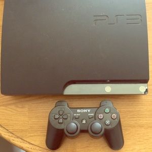 Black Sony PS3 slim with 3 games