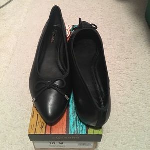 Black flats with bow design.