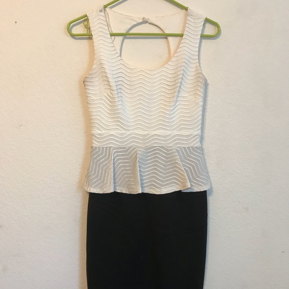 Blacks/white dress with a peplum top, sleeveless