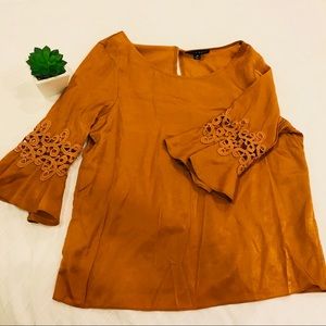 Burnt orange bell sleeve blouse with lace detail Burnt orange bell sleeve blouse with lace detail