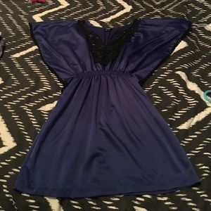 Cute dress of deep royal blue with black trim.