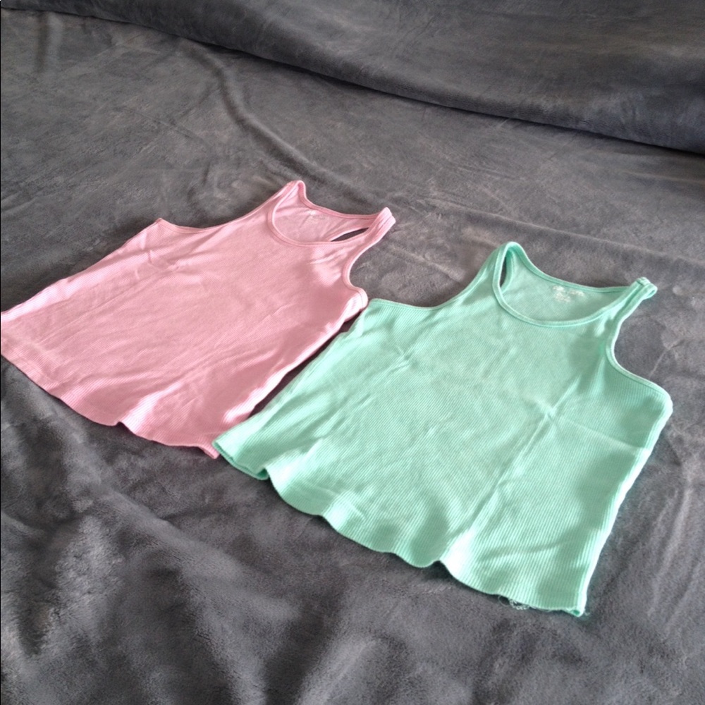 Pink and aqua colored shirts