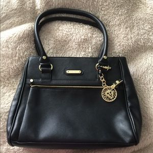 Black Anne Klein handbag with gold accents