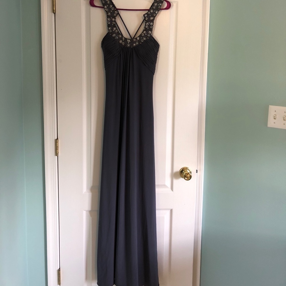 Gray, jeweled floor length dress.