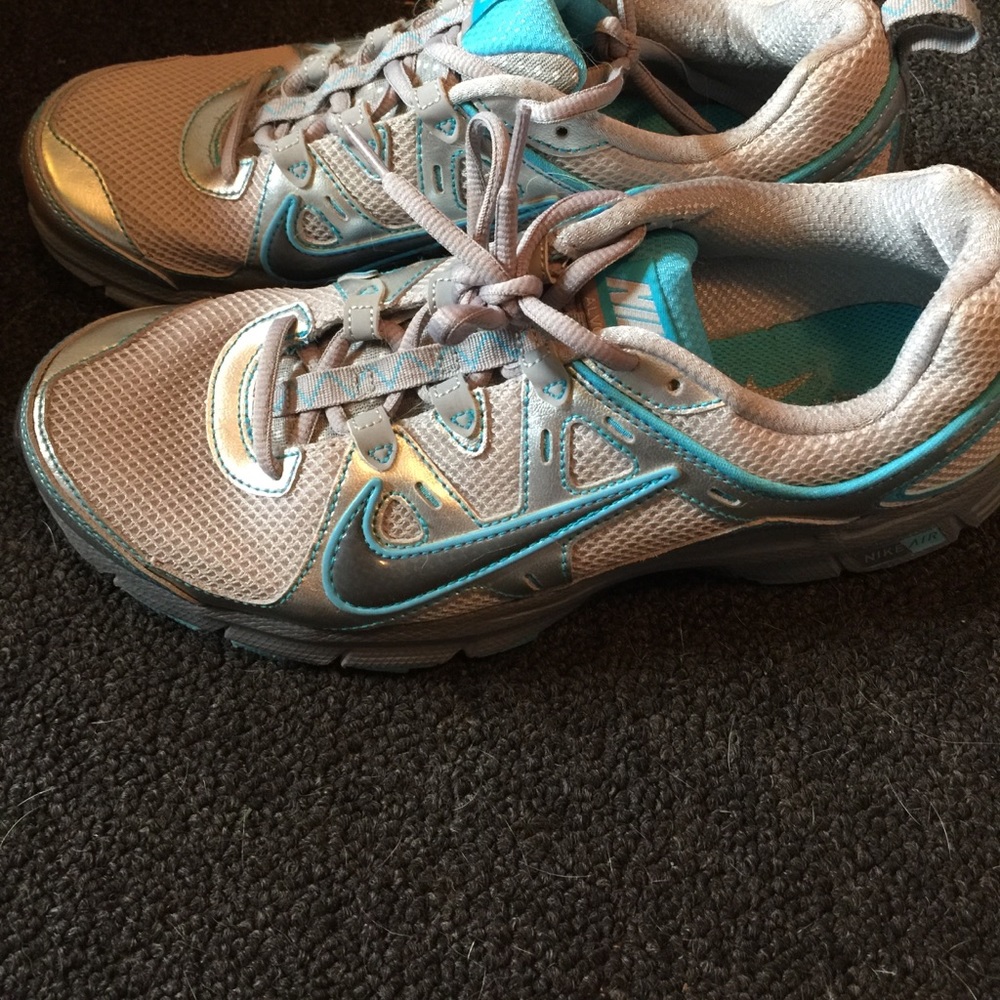 Light great with blue Nike sneakers